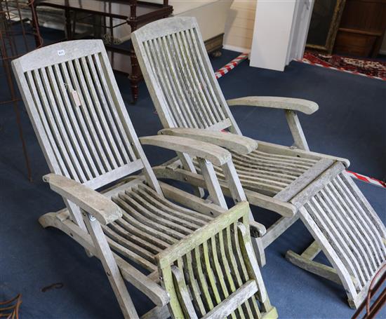 A pair of Indian Ocean teak folding loungers